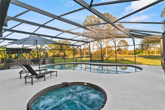 outdoor pool featuring glass enclosure, a jacuzzi, a patio area, and a lawn