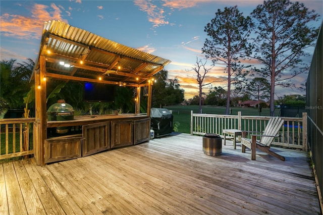 wooden deck featuring area for grilling