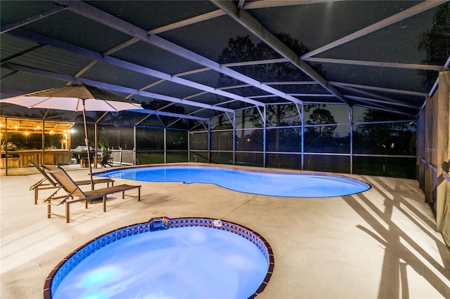 outdoor pool with a lanai and a patio area