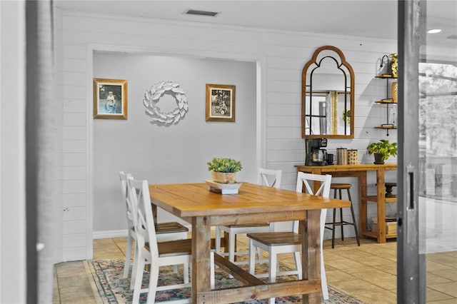 dining room with light tile patterned floors and visible vents