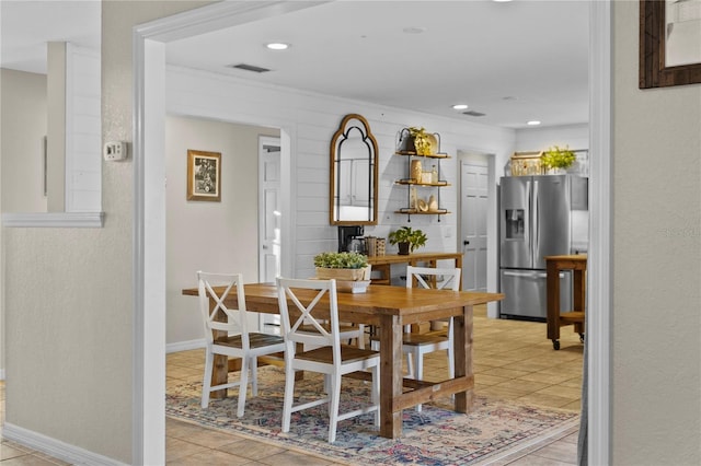 dining space with light tile patterned floors, visible vents, recessed lighting, and baseboards