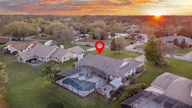 aerial view at dusk with a residential view