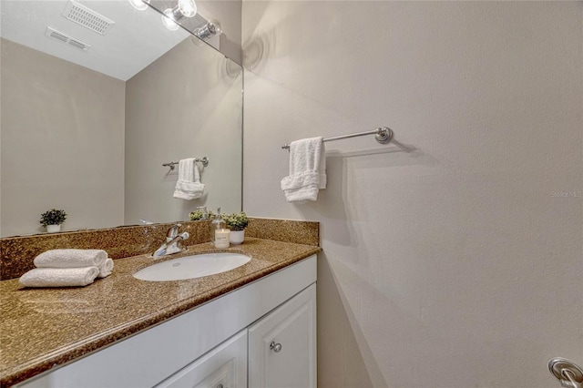 bathroom with visible vents and vanity