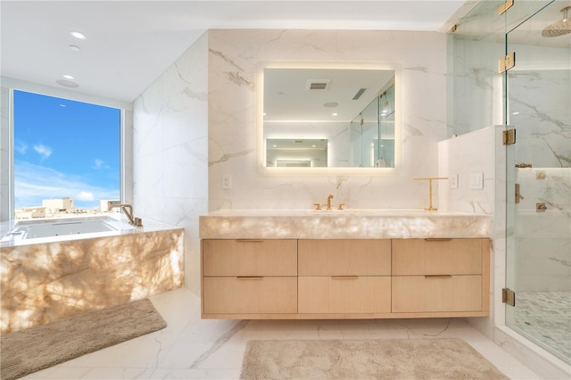 bathroom with vanity, a garden tub, visible vents, and a marble finish shower