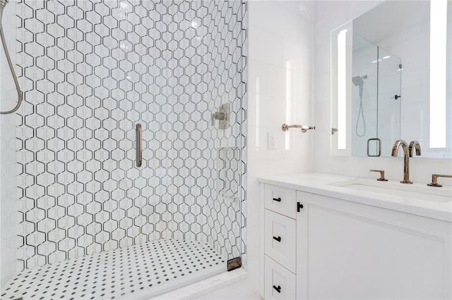 bathroom with vanity and a shower stall