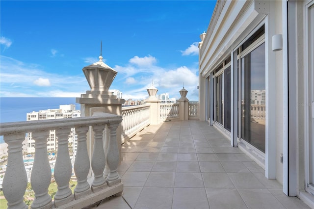 balcony featuring a water view