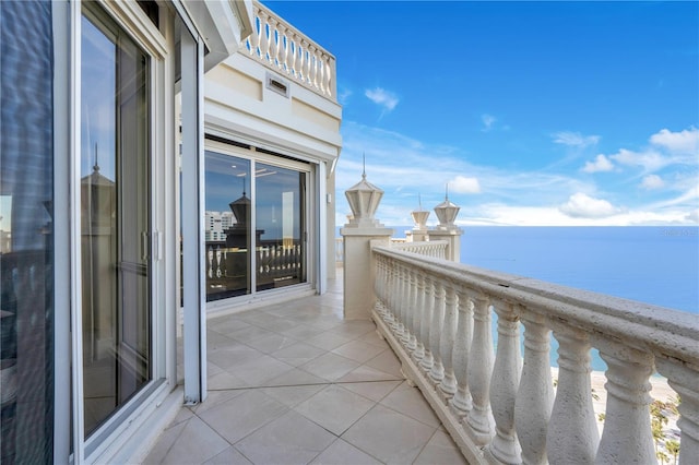 balcony featuring a water view