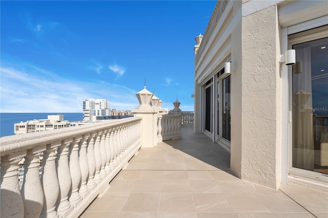 balcony with a city view and a water view