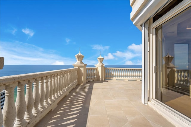 balcony featuring a water view