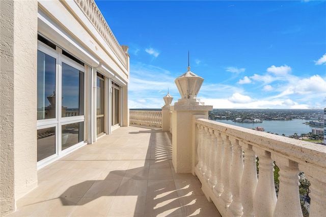 balcony featuring a water view