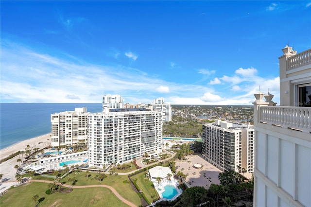 birds eye view of property featuring a water view and a city view