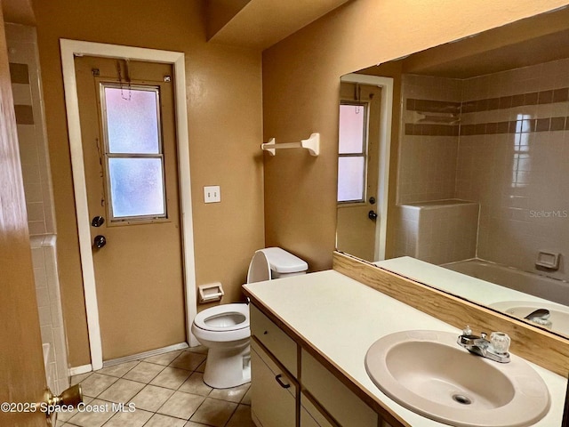 bathroom with tile patterned floors, toilet, baseboards, walk in shower, and vanity