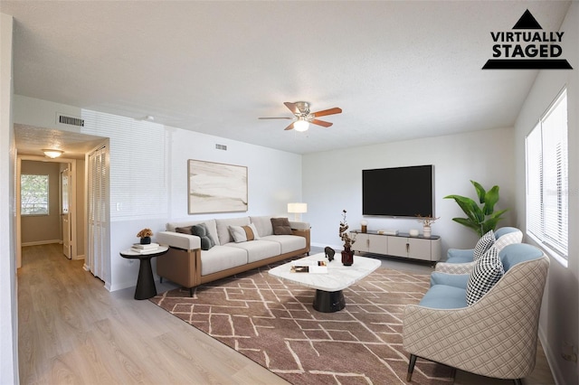 4605 Bayshore Dr Unit 6, Naples, FL 34112 - living room featuring wood finished floors and a ceiling fan