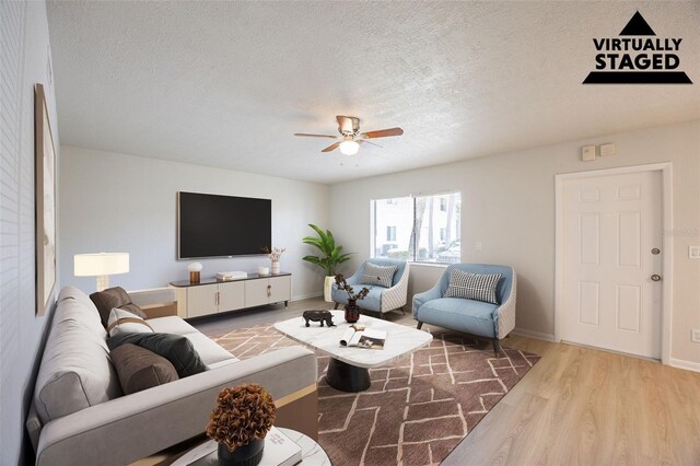 4605 Bayshore Dr Unit 6, Naples, FL 34112 - living area with a ceiling fan, a textured ceiling, and wood finished floors