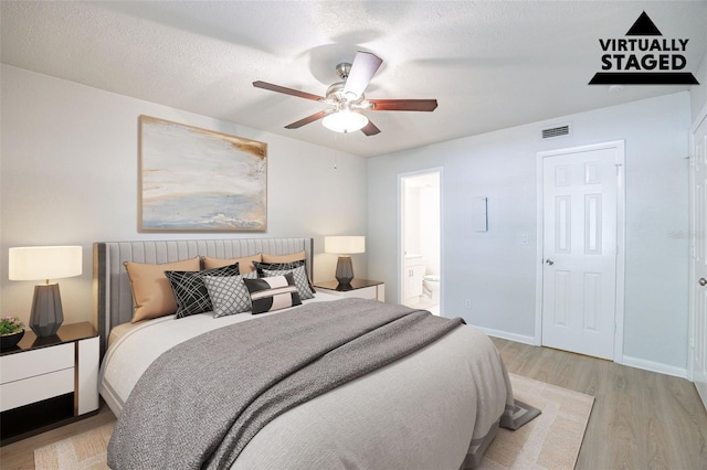 4605 Bayshore Dr Unit 6, Naples, FL 34112 - bedroom with light wood finished floors, ensuite bathroom, and ceiling fan