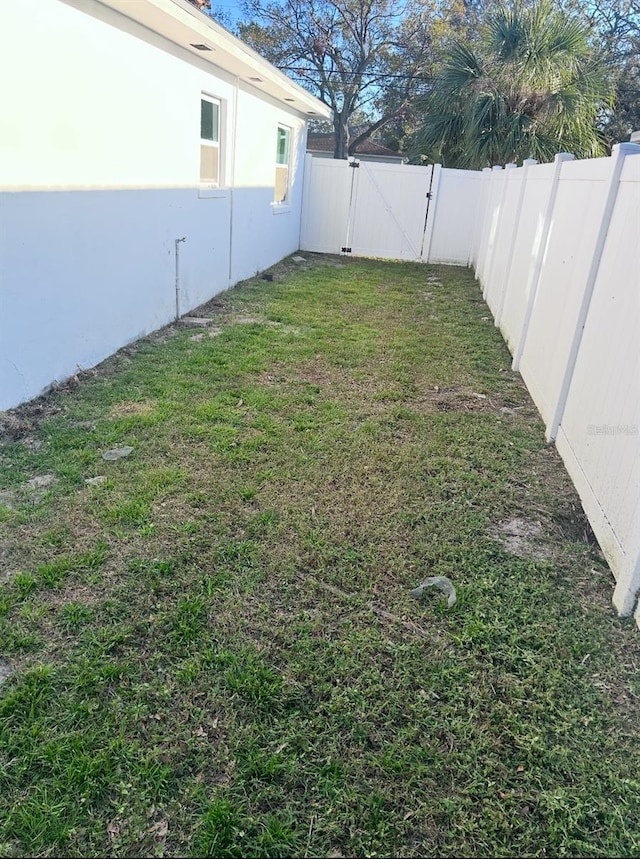 view of yard featuring a gate