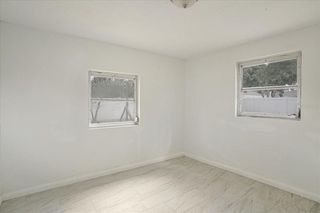 empty room with baseboards