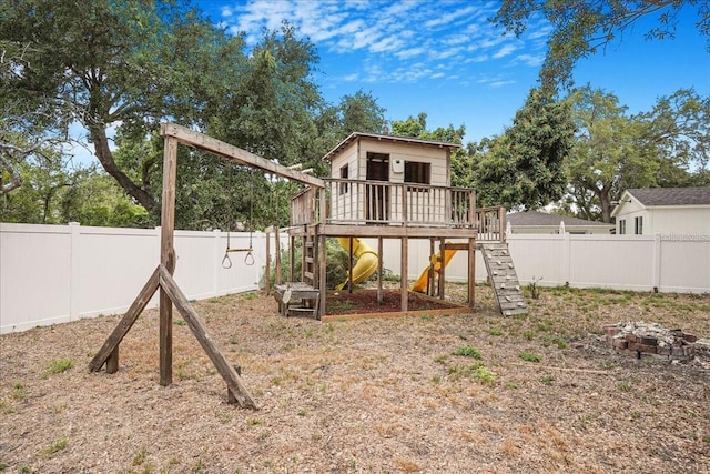 view of playground with a fenced backyard