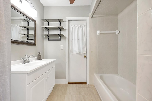 bathroom featuring shower / bathtub combination with curtain, baseboards, and vanity