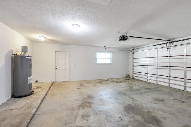 garage featuring concrete block wall, a garage door opener, and electric water heater