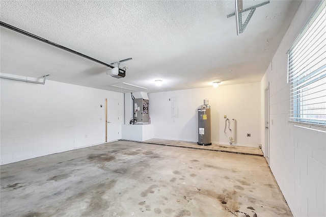 garage with electric panel, heating unit, electric water heater, a garage door opener, and concrete block wall