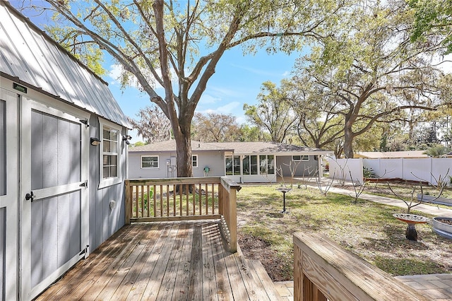 wooden terrace featuring fence