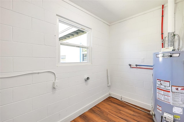 utility room featuring water heater