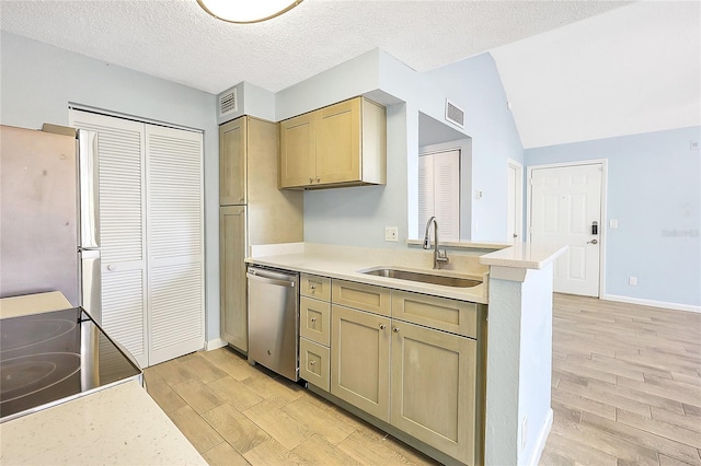 kitchen featuring a sink, light countertops, visible vents, and stainless steel appliances