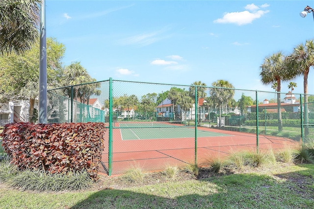 view of tennis court with fence