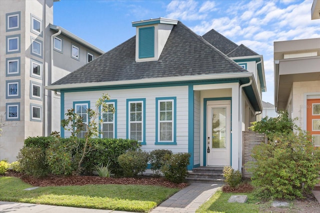 view of front facade with a shingled roof