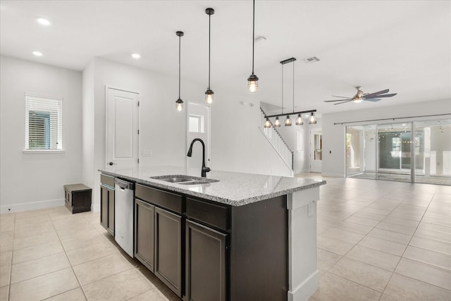 kitchen with visible vents, light tile patterned flooring, a sink, dishwasher, and open floor plan