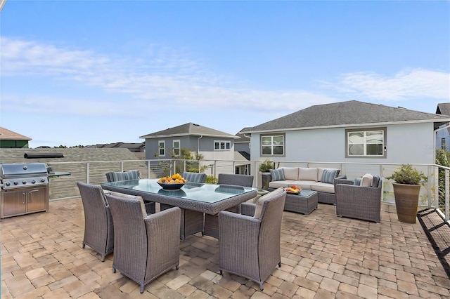 view of patio with outdoor dining space, outdoor lounge area, and grilling area