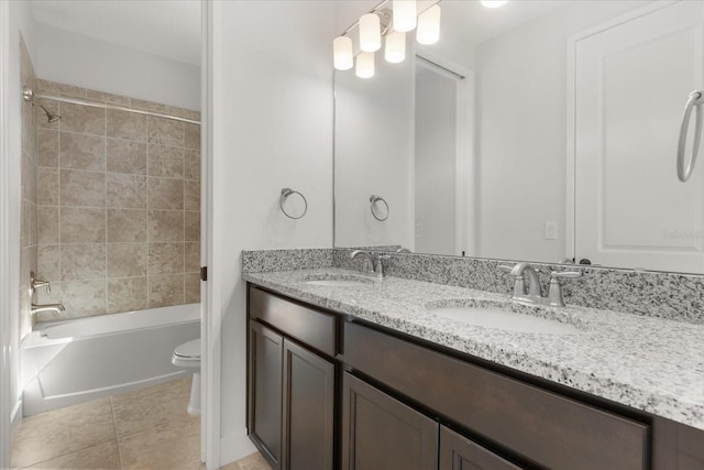 full bathroom with a sink, shower / bath combination, toilet, and double vanity