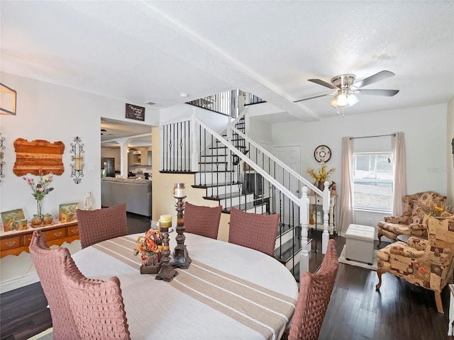 dining area featuring stairs, wood finished floors, and a ceiling fan