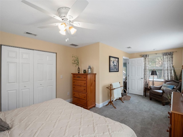 bedroom with carpet flooring, baseboards, visible vents, and a closet