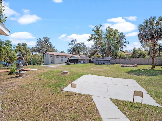 view of yard featuring a patio area and fence