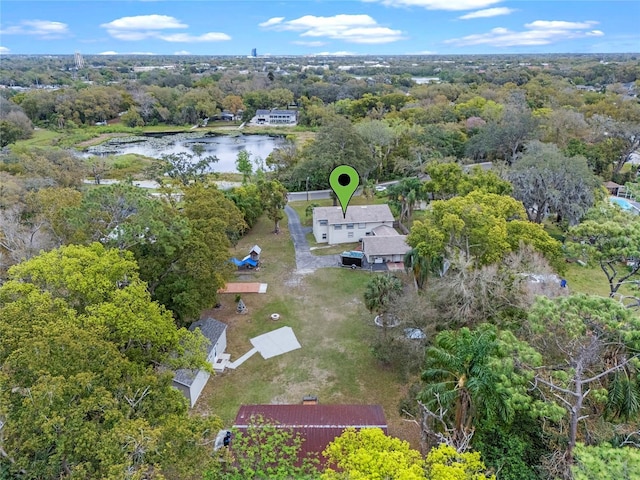 aerial view featuring a water view and a view of trees