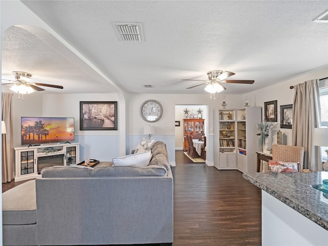 500 Forest Lake Dr, Altamonte Springs, FL 32714 - living room with a ceiling fan, a textured ceiling, and dark wood finished floors