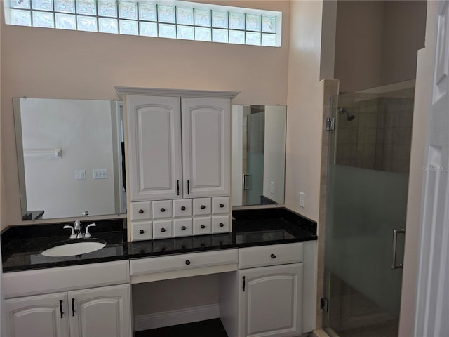 full bathroom featuring vanity and a stall shower