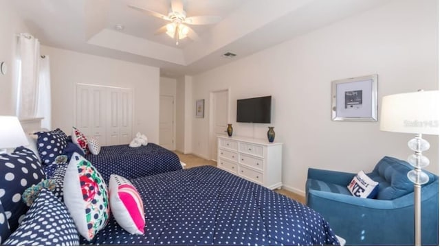 4507 Monado Dr, Kissimmee, FL 34746 - carpeted bedroom with a raised ceiling, baseboards, visible vents, and a closet