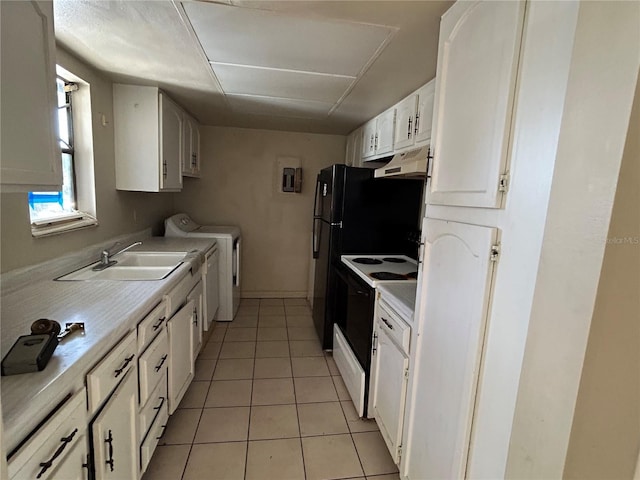 kitchen with under cabinet range hood, range with electric stovetop, independent washer and dryer, white cabinetry, and a sink