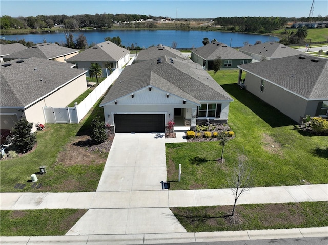 bird's eye view featuring a residential view and a water view