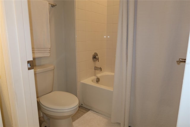 full bath with tile patterned floors, toilet, and shower / tub combo