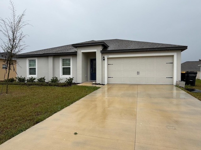 view of front of house with a shingled roof, concrete driveway, a front yard, stucco siding, and an attached garage