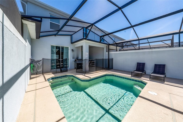 view of swimming pool with a fenced in pool, a lanai, and a patio area