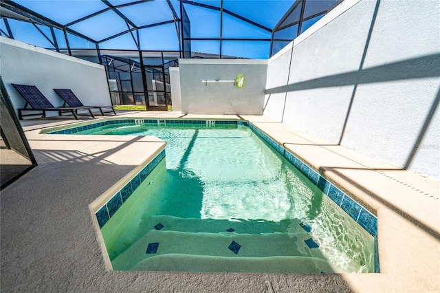 community pool with a lanai and a patio area