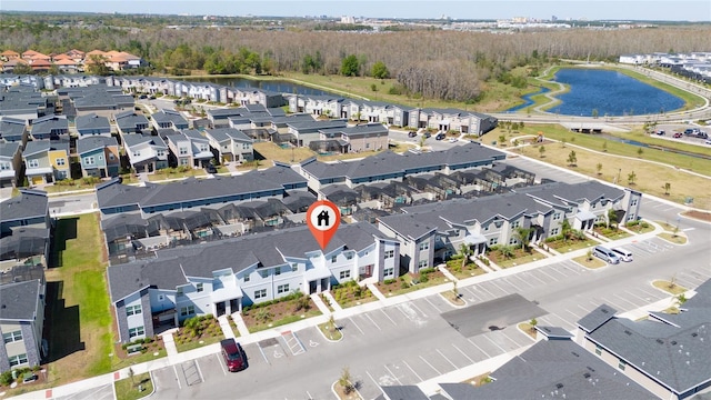 aerial view featuring a residential view and a water view