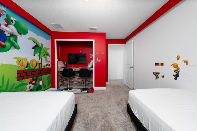 carpeted bedroom featuring visible vents, baseboards, and a textured ceiling