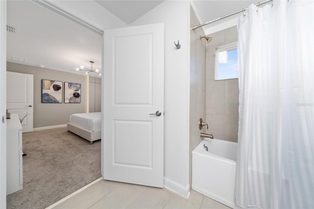 full bathroom featuring visible vents, baseboards, shower / bath combo, tile patterned flooring, and a notable chandelier