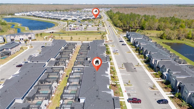 aerial view with a water view and a residential view